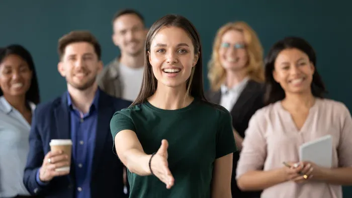 Group of people smiling ready to greet you