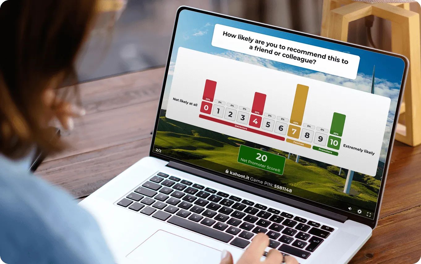A person looking at a laptop screen displaying the results of a Net Promoter Score (NPS) survey with the question, "How likely are you to recommend this to a friend or colleague?"