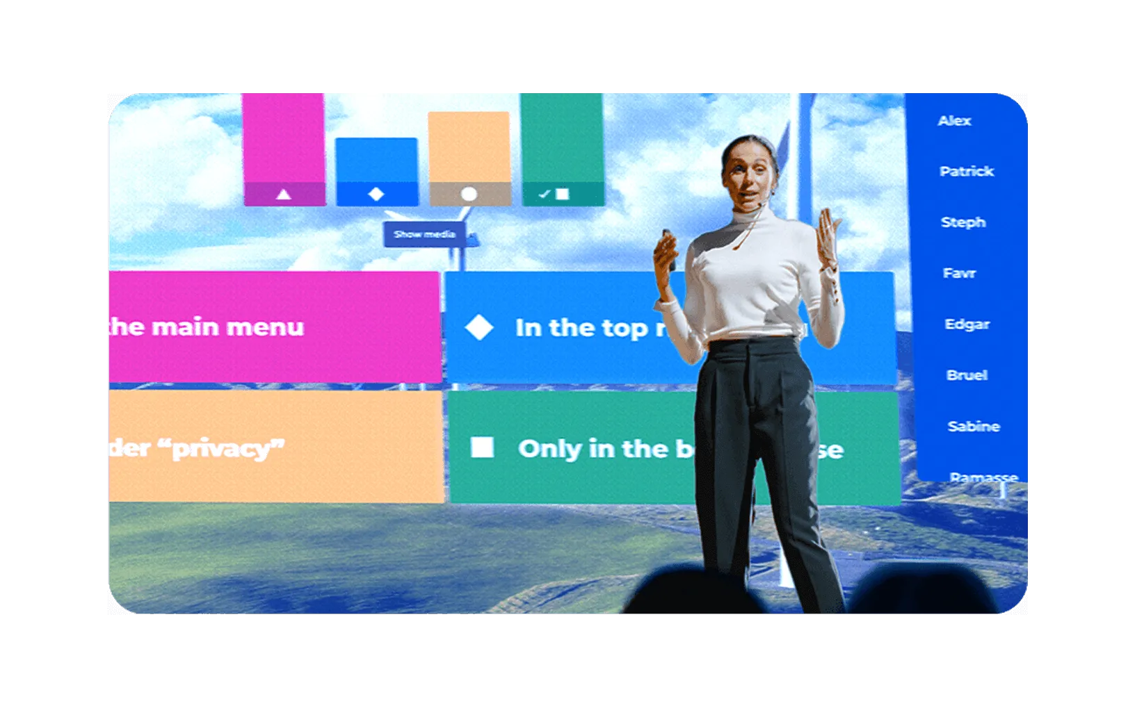 Presenter hosting a live Kahoot quiz on stage with colorful answer tiles and participant leaderboard displayed behind her