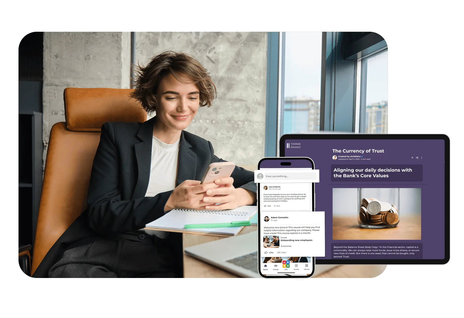 Businesswoman smiling while engaging with her phone and viewing corporate learning content about core values on a tablet in an office setting.