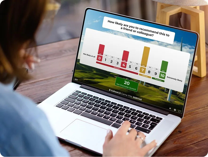 An over-the-shoulder view of a person using a laptop to view a Kahoot! Net Promoter Score (NPS) poll.