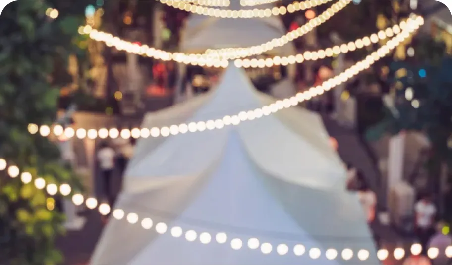 String lights zig zagging above a marquee