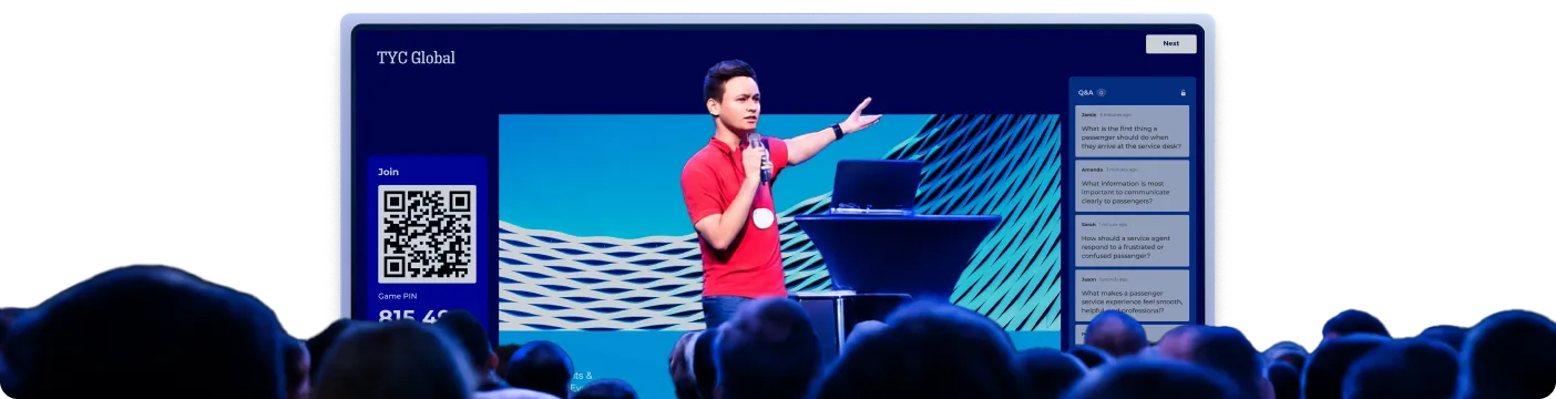 Conference presenter on screen with a Kahoot Q&A panel and game PIN displayed to a live audience
